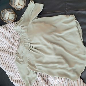 A sage green blouse